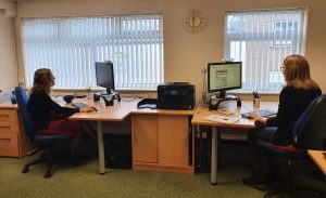 Catherine and Eveline working at desks | Blog | Technical and commercial translation specialists