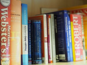 Bookshelf with dictionaries | CPD Store | German translation services